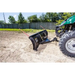 Green utility vehicle front-mounted with Swisher 62-inch plow rolled blade pushing soil, gallery position 1