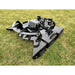 Stinger Attachments TF3 Twister skid steer brush cutter on grass, gallery position 17, 800x800 square image.
