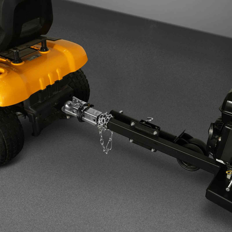 Close-up of hitch attachment connecting tow bar on yellow riding lawn mower to black frame of MechMaxx wood chipper gallery 1