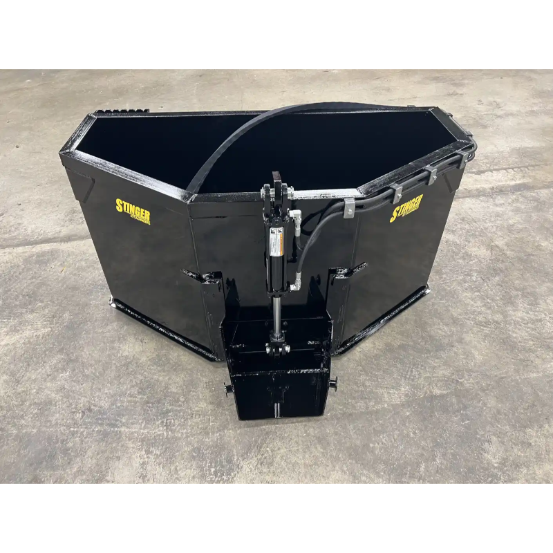 Black steel concrete bucket skid steer attachment with hydraulic cylinder and reinforced cutting edges on concrete floor