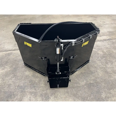 Black Stinger skid steer attachment with hydraulic mechanism on concrete surface