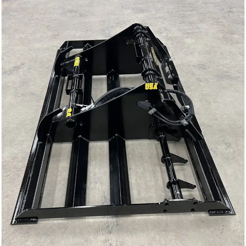 Right side view of black steel skid steer land plane attachment with hydraulic cylinders and auger on concrete floor