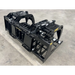Black skid steer root and rock grapple attachment with dual hydraulic cylinders and reinforced frame on concrete floor