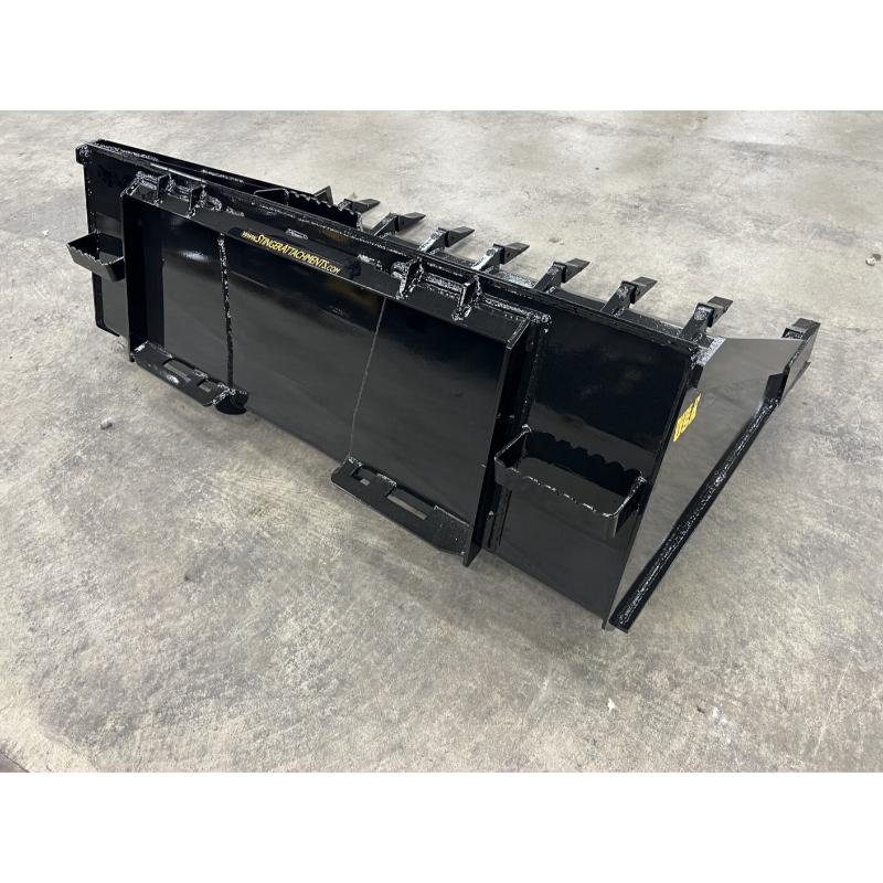 Black steel loader attachment with multiple mounting brackets and reinforced cutting edges on concrete floor