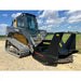 John Deere compact track loader with black disc mulcher attachment on gravel surface under partly cloudy sky