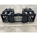 Black steel tractor root and rock grapple attachment with dual hydraulic cylinders and grid-style tines on concrete floor