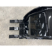Black skid steer bucket attachment with three flat rectangular digging teeth and curved back on concrete floor