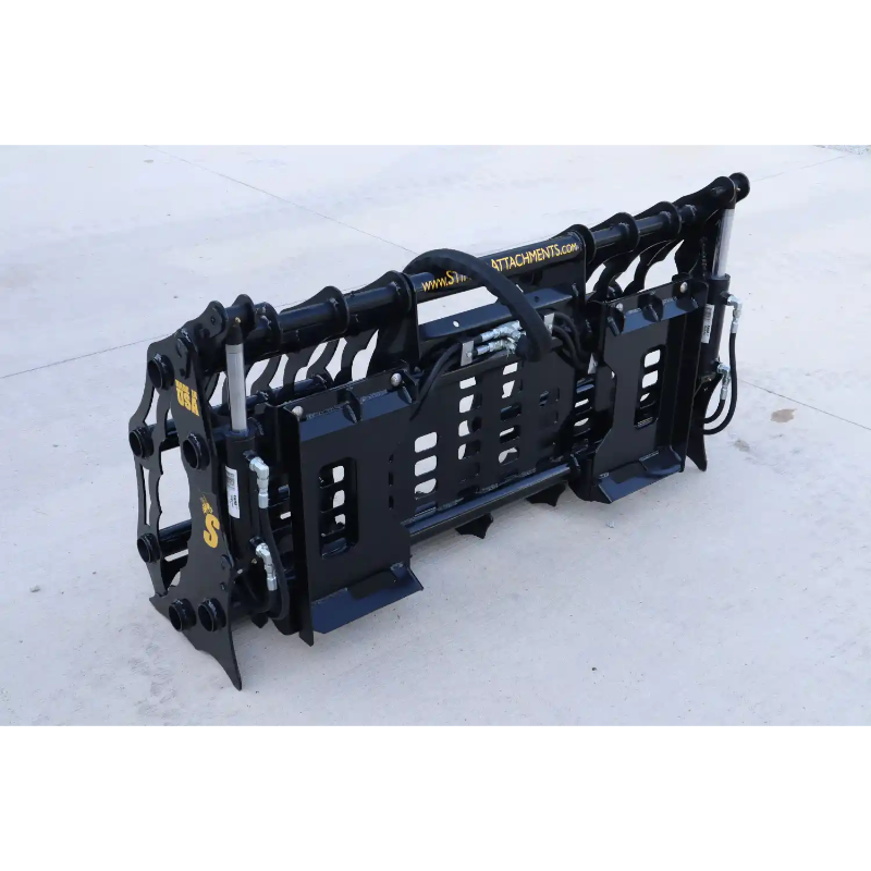 Black steel compact clamp grapple attachment with hydraulic cylinders and mounting brackets on concrete surface outdoors
