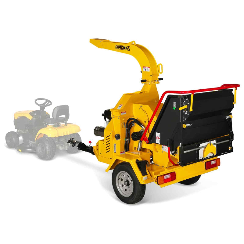 Rear perspective of yellow CROBA hydraulic wood chipper with feed chute guard and single axle trailer, gallery position 1