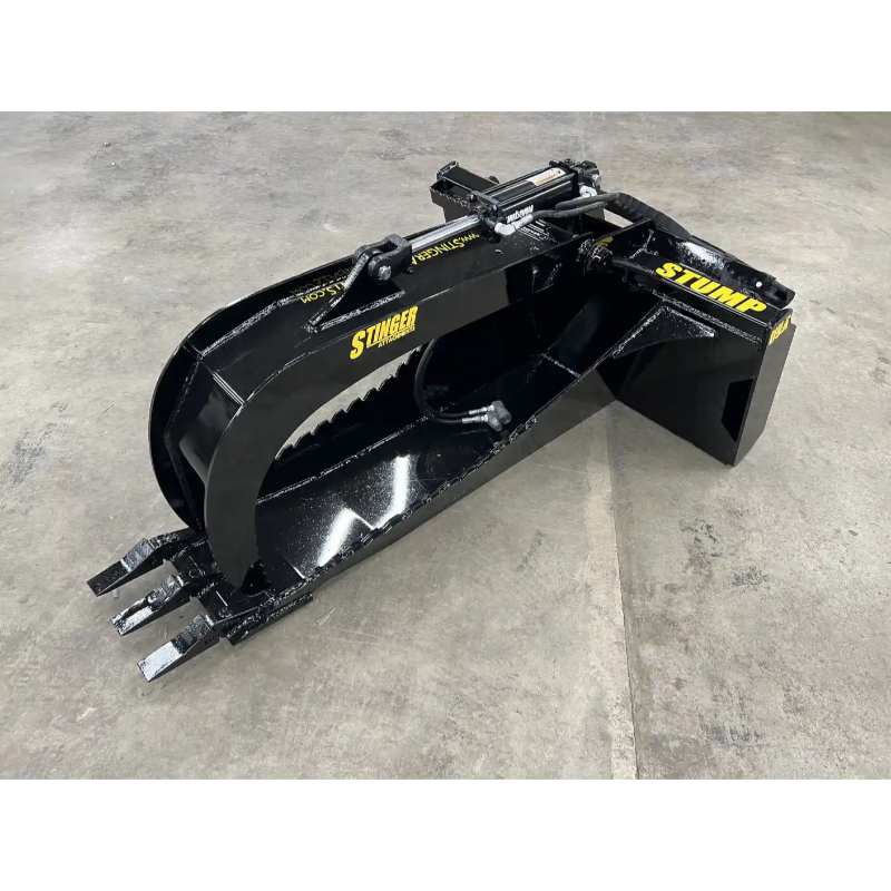 Black skid steer stump bucket grapple attachment with serrated grapple arm and three pointed digging teeth on concrete floor