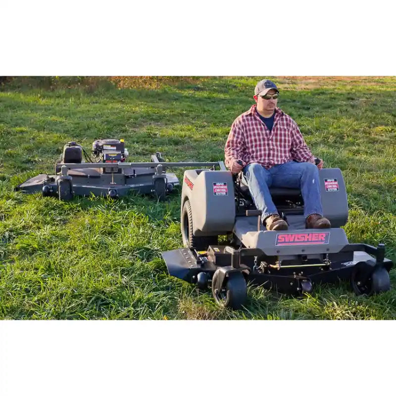 Operator on zero-turn mower towing Swisher 60-inch finish cut mower with 15.5HP engine, gallery position 1