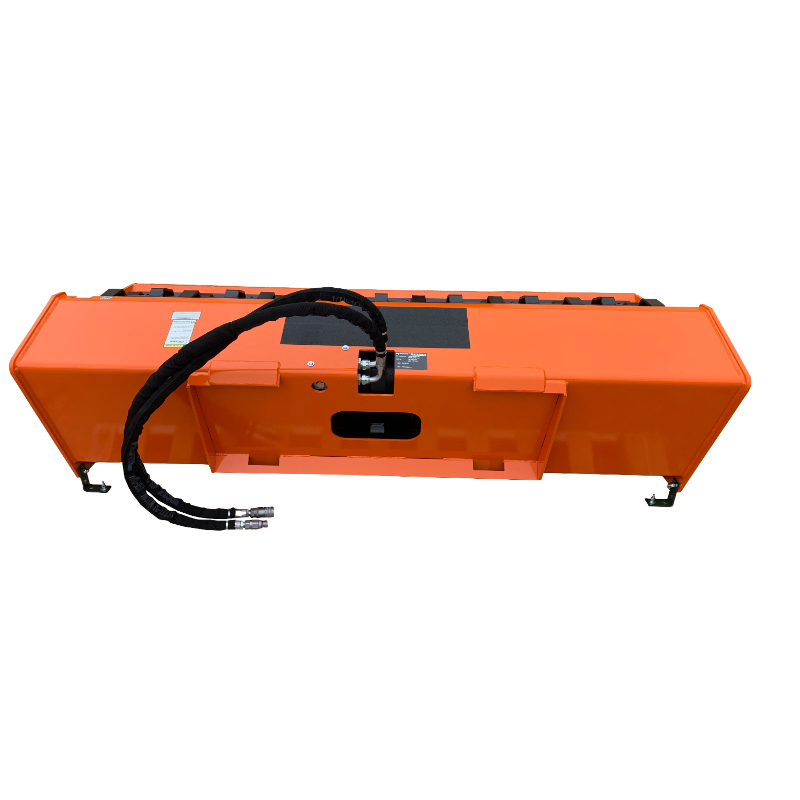Orange hydraulic skid steer attachment with hoses and flat metal base viewed from rear angle