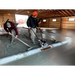 Three workers using MBW WS500 ScreeDemon vibratory wet screed to smooth freshly poured concrete indoors, gallery position 1
