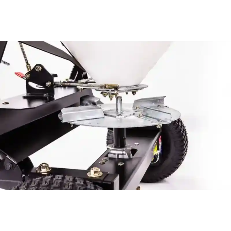 Close-up of rotating spreader disk and metal frame on Swisher 52-Gallon Tow-Behind Spreader, gallery position 1