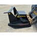 Black steel disc mulcher attachment with hydraulic hoses connected to skid steer on gravel surface