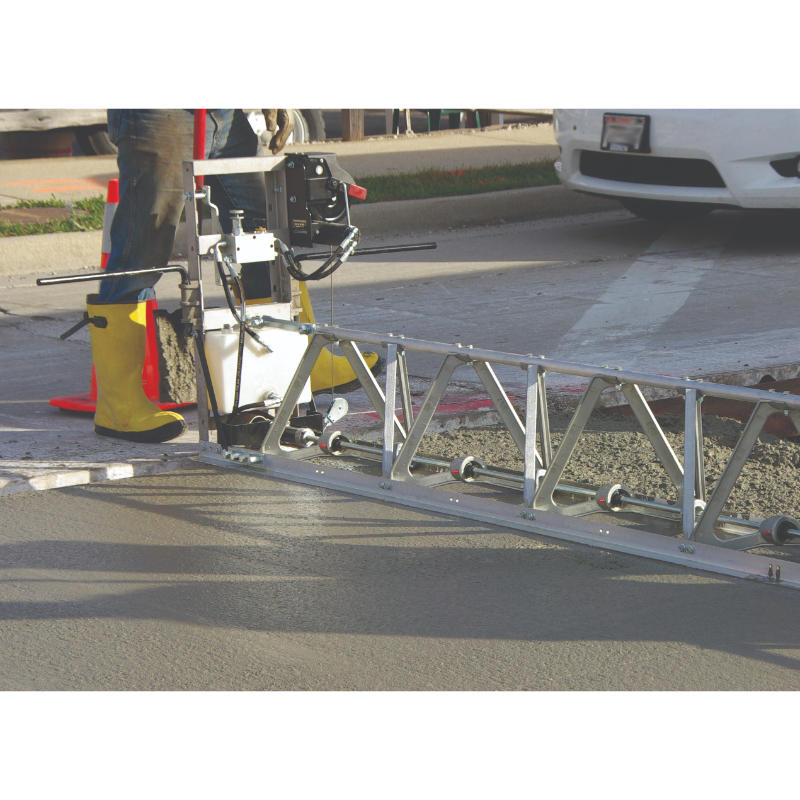 MBW Modular Vibratory Truss Screed section leveling freshly poured concrete on road surface, gallery position 1