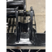 Close-up of black painted steel mounting bracket with welded reinforcements and pin for skid steer grapple attachment