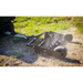 Swisher 48-inch driveway grader connected to ATV, angled side view, grading dirt with ground leveler and dual front wheels, gallery position 1