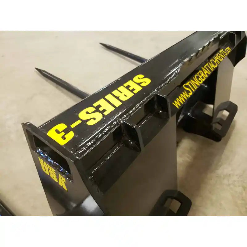 Close-up of Stinger Attachments BS3 Series 3 Skid Steer Bale Spear with visible spear tips and Series-3 label, gallery 9.
