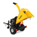 Rear angled view of yellow MechMaxx 5 inch disc wood chipper with E-start gasoline engine and tow bar gallery position 1