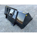 Black steel tractor attachment bucket with reinforced back and mounting brackets resting on gravel surface outdoors
