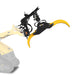 side perspective of yellow and black MechMaxx hydraulic rotating log grapple mounted on mini skid steer gallery position 1