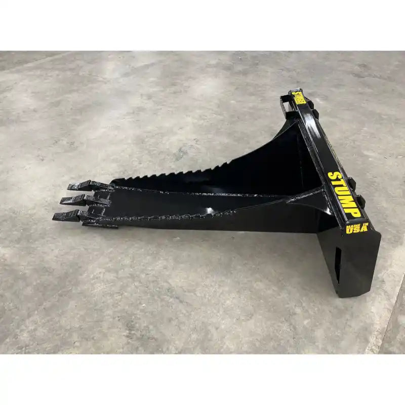 Black skid steer stump bucket attachment with three reinforced digging teeth and angled scooped profile on concrete floor