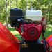 Close-up of Honda GX390 engine mounted on red MechMaxx 6 inch gas-powered drum wood chipper, gallery position 1