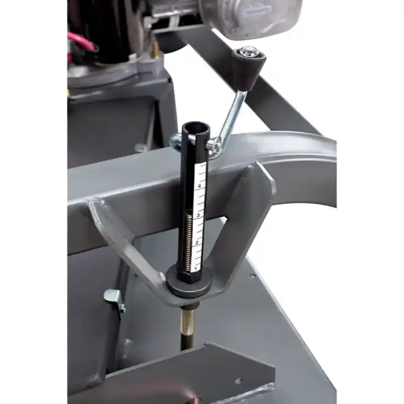 Close-up of height adjustment gauge and locking lever on Swisher 60-inch finish cut mower, gallery position 1