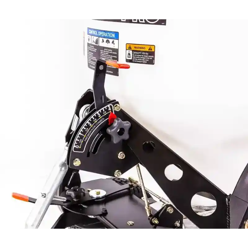 Close-up of adjustment lever, control dial, and black metal frame on Swisher 52-Gallon Tow-Behind Spreader, gallery position 1