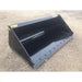 Front-left angled view of black steel skid steer bucket with bolt-on cutting edge on compacted dirt surface