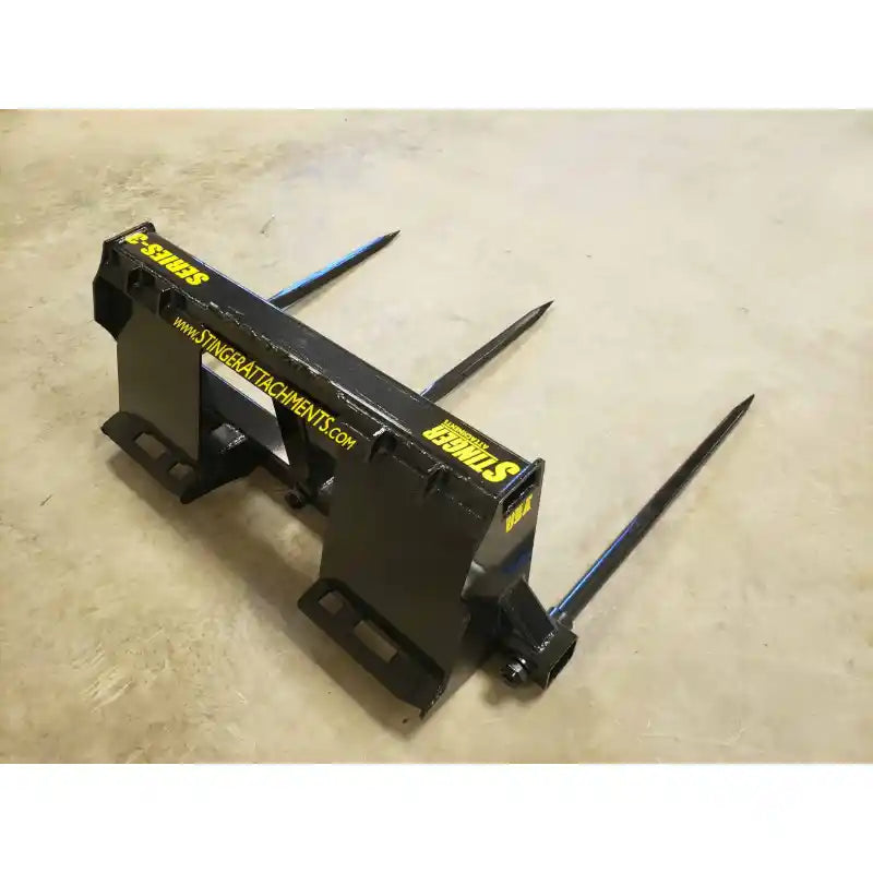 Skid steer bale spear with three 43-inch spears in gallery position 15, shown on concrete floor, 800x800 square image.