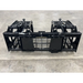 Black steel skid steer root and rock grapple attachment with hydraulics, spaced tines, and reinforced side panels on concrete floor