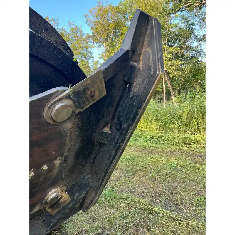 Close-up of the Stinger TF5 Twister Skid Steer Brush Cutter blade edge and mounting hardware, gallery image 17.