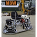 Walk-behind concrete power trowel with padded operator seat, dual control handles, and gasoline engine motor on smooth slab surface
