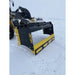 Front angle of black and yellow skid steer snow pusher attachment clearing snow on flat snowy terrain