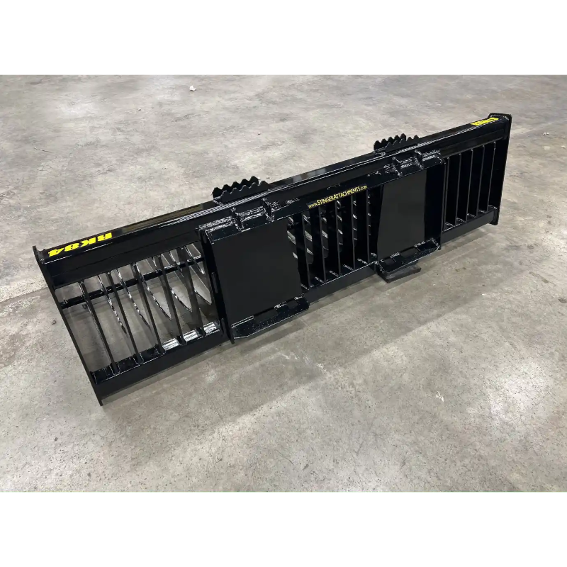 Wide black metal skid steer rock bucket attachment with vertical tines and reinforced back plates on concrete floor