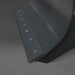 close-up angled view of cutting edge and blade thickness on black 57-inch hydraulic mini skid steer dozer blade gallery 1