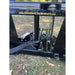 Black steel tractor tree puller attachment frame with hydraulic hoses and mounting components on grass with dry leaves