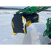 Curved black and yellow steel snow pusher attachment raised on green skid steer loader arm over snowy field