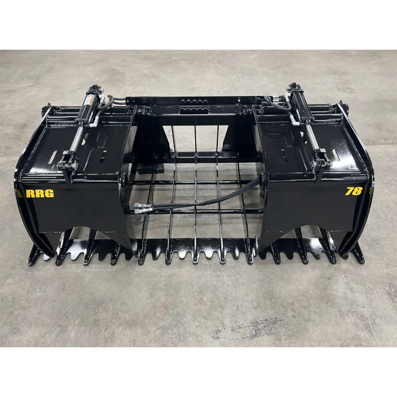 Black steel root and rock grapple attachment with dual hydraulic cylinders and heavy tines on concrete floor