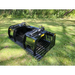 Black steel skid steer grapple attachment with spaced curved tines, hydraulic arms, and reinforced side plates on grass outdoors