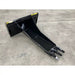 Black steel stump bucket attachment with tapered body and three digging teeth on concrete floor indoors