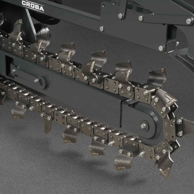 close-up view of metal cutting teeth and chain on MechMaxx 20-inch mini skid steer trencher gallery position 1