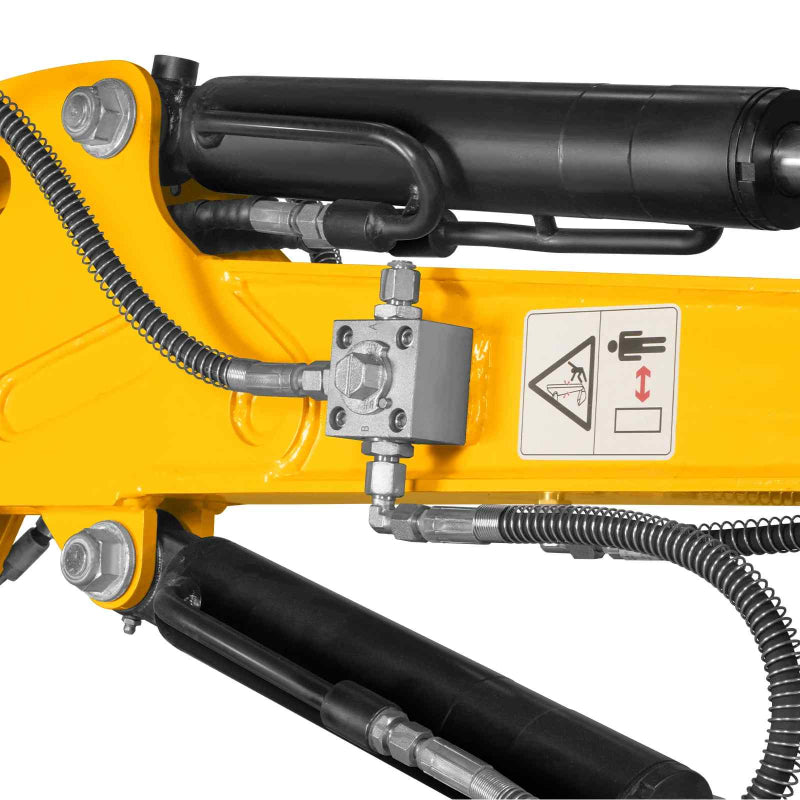 close-up of hydraulic components, hoses, and warning decal on yellow arm of MechMaxx MEC10 mini excavator gallery position 1