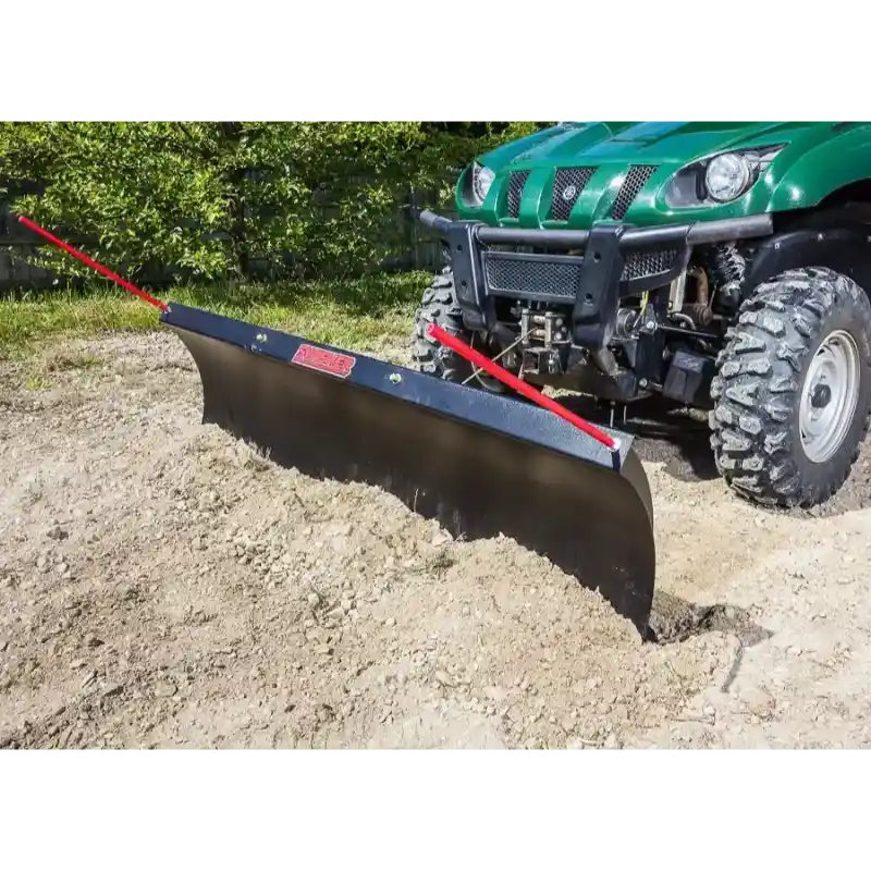 Green UTV fitted with black 62-inch Swisher angle plow pushing loose soil with red positioning rods, gallery position 1
