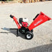 Side profile of MechMaxx GS650 wood chipper with Honda GX200 engine, towbar, and gravel surface, gallery position 1