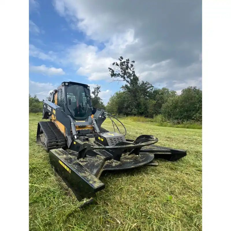 Stinger Attachments TF5 Twister skid steer brush cutter on grass field with cloudy sky, gallery position 7, 800x800 square image
