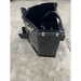 Black steel skid steer concrete bucket with hydraulic hose and reinforced frame on concrete surface indoors