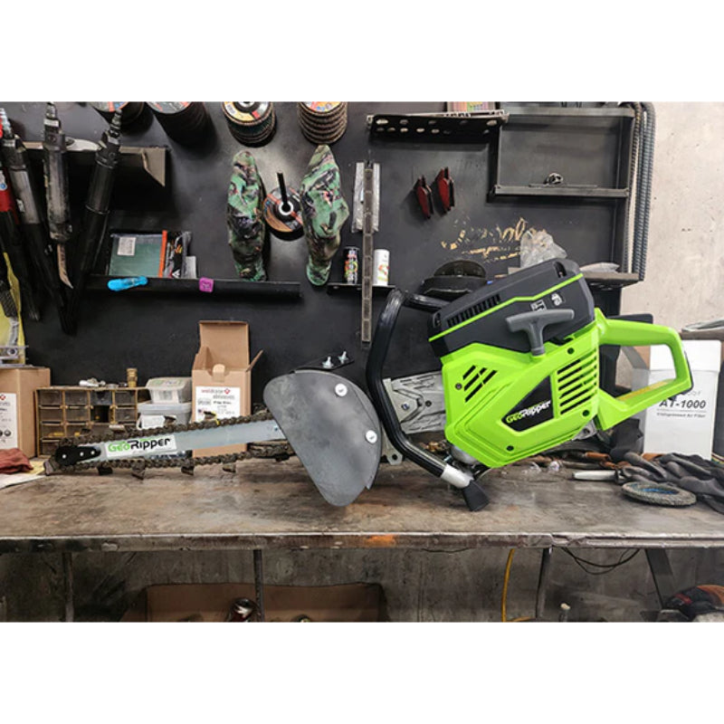 GeoRipper GR520 handheld mini trencher with 20-inch chain and green frame resting on workshop bench gallery position 1
